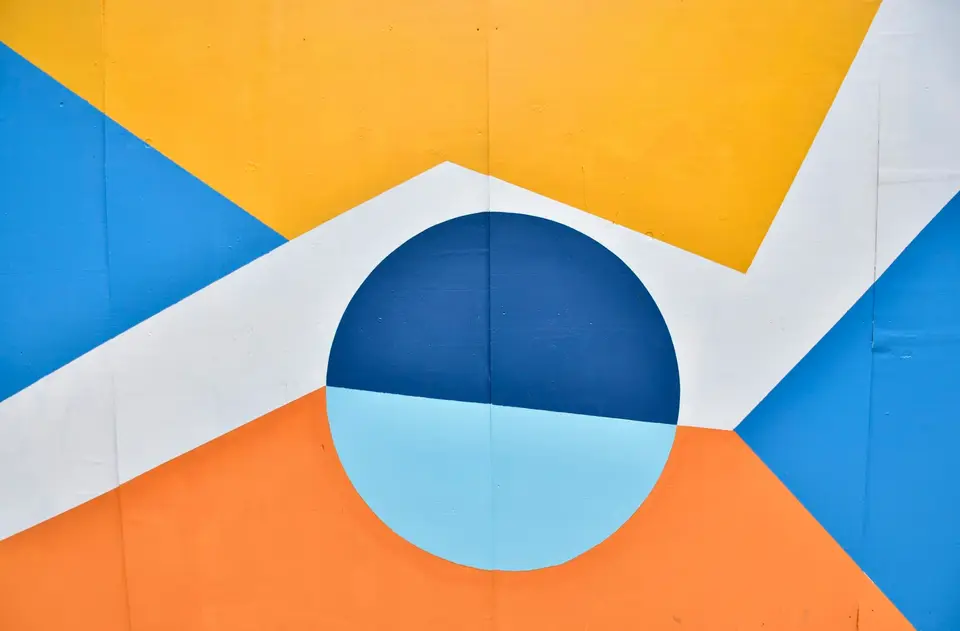 Painted circle split blue over orange
