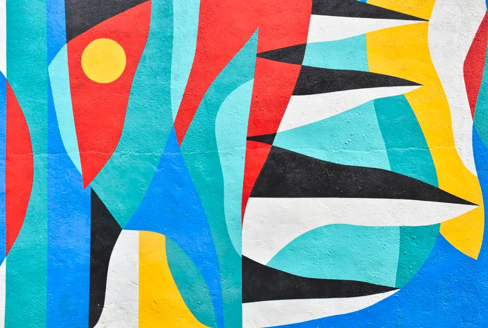 Bold flat shapes painted on a wall